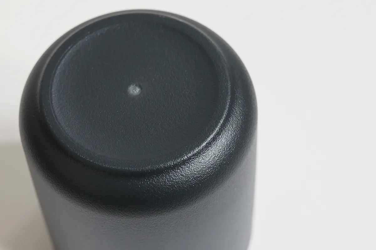 Detailed view of molded base on recycled PET tumbler cup