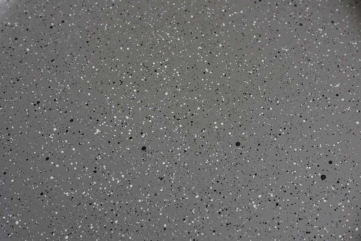Close-up of speckled finish on stoneware-inspired recycled PET dinner plate