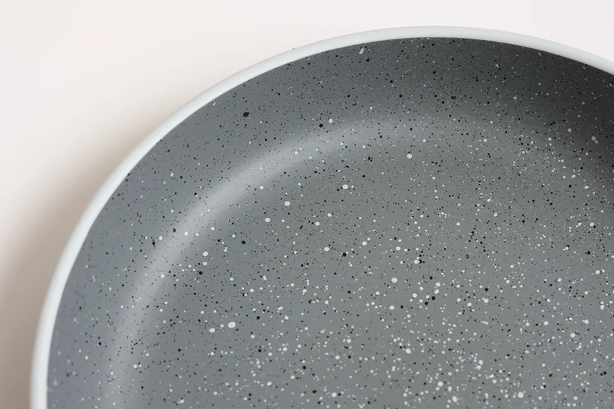 Speckled stoneware-inspired finish detail on recycled PET pasta bowl