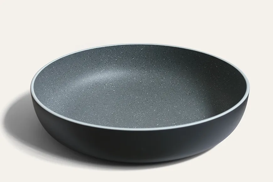 Side view of stoneware-inspired recycled PET pasta bowl
