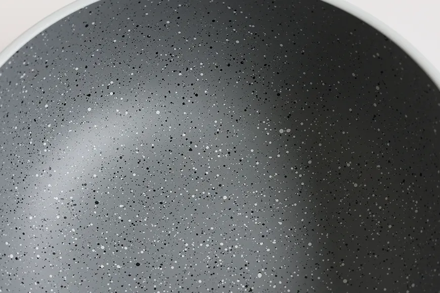 Speckled stoneware-inspired finish detail on recycled PET serving bowl