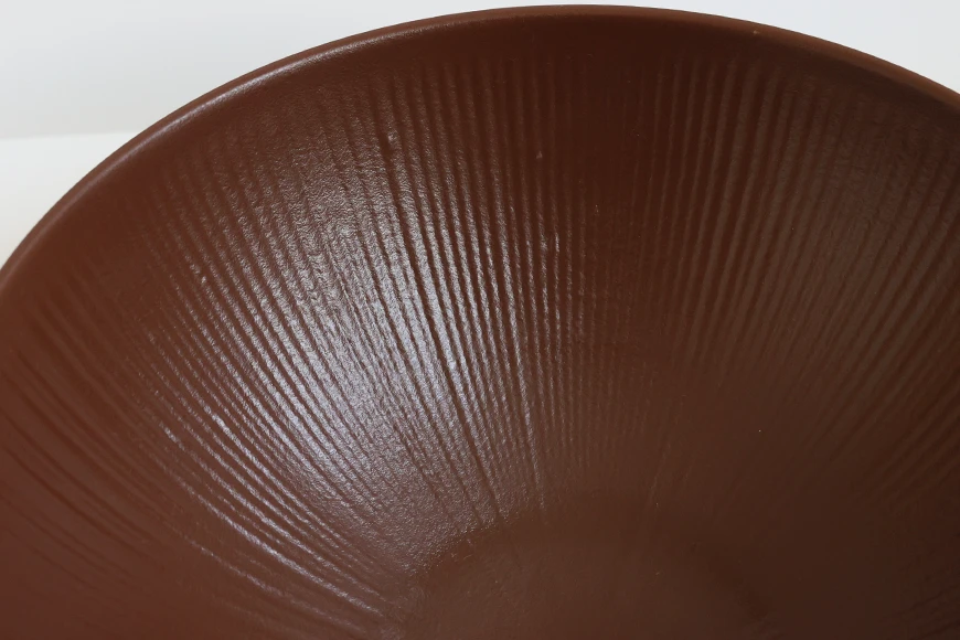 Close-Up of Radial Texture Pattern on Chestnut Brown Bowl